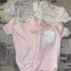 Calvin Klein 4 Pack Onesies- size 18M